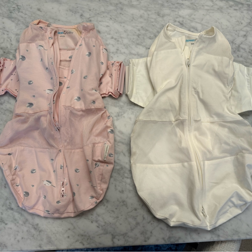 Size small Snoo swaddle sleep sacks. White never used, pink gently used.